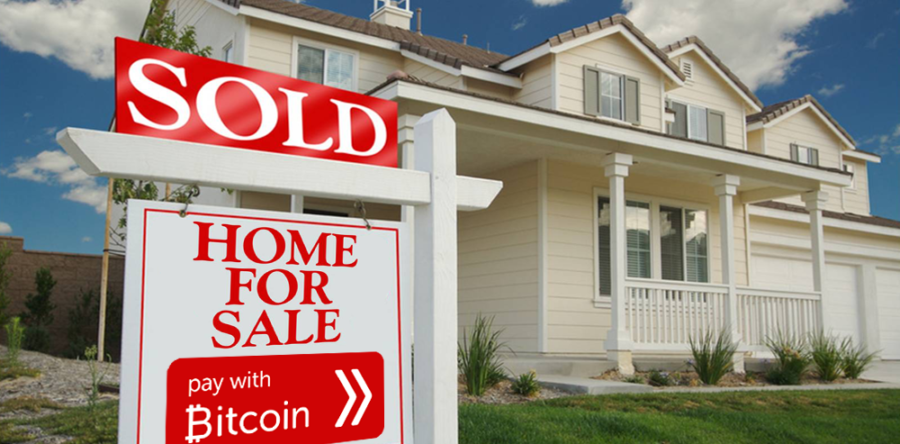 Home with sold sign that says pay with Bitcoin